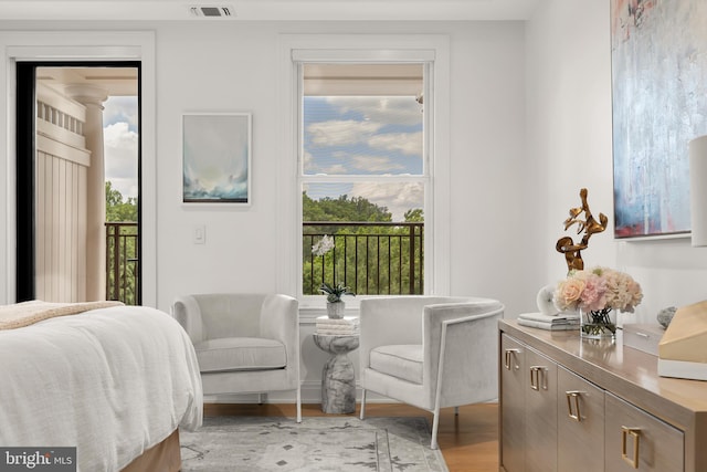 8551 Connecticut Ave Unit 210, Chevy Chase, MD 20815 - bedroom featuring access to outside and light hardwood / wood-style flooring