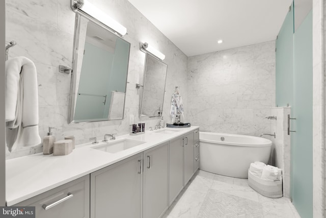 8551 Connecticut Ave Unit 210, Chevy Chase, MD 20815 - bathroom featuring vanity, separate shower and tub, and tile walls