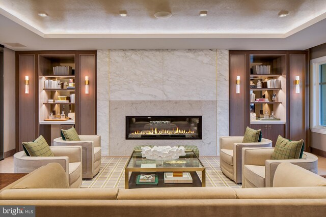 8551 Connecticut Ave Unit 210, Chevy Chase, MD 20815 - living room with a raised ceiling, a fireplace, and built in features