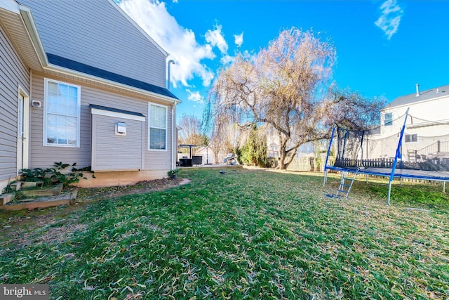 view of yard with a trampoline