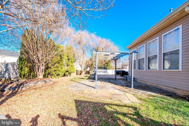 view of yard featuring a patio area and a pergola