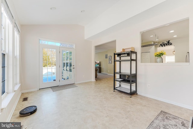 doorway featuring vaulted ceiling