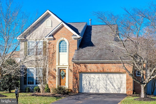 front of property with a garage