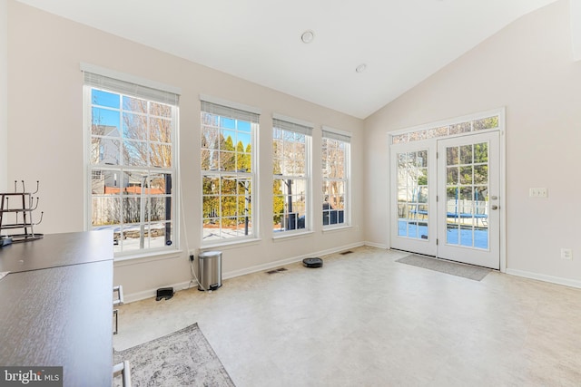 doorway to outside featuring vaulted ceiling