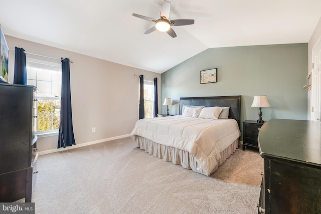 bedroom featuring ceiling fan, light carpet, and lofted ceiling