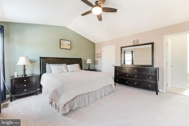 bedroom with light carpet, ceiling fan, and vaulted ceiling