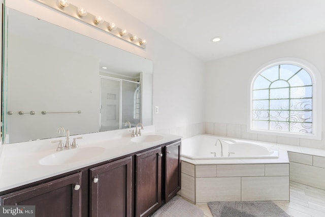 bathroom with vanity, shower with separate bathtub, and tile patterned flooring