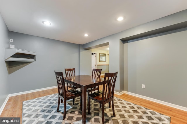 dining area with wood-type flooring