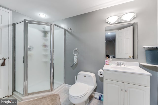 bathroom with toilet, a shower with door, and vanity