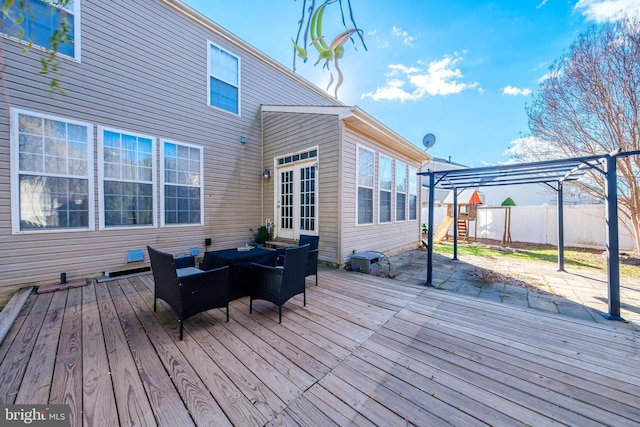 deck featuring outdoor lounge area, a playground, and a pergola