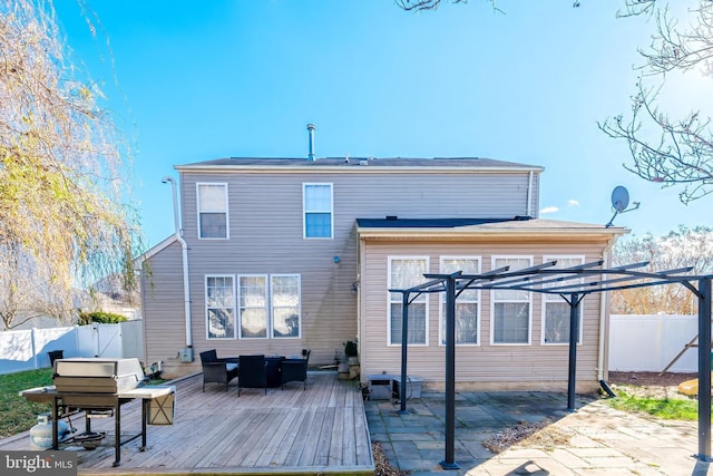 back of house featuring a deck, a pergola, and outdoor lounge area