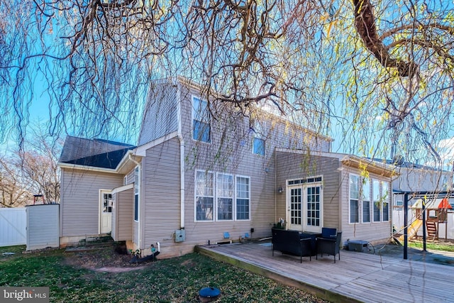 back of property with outdoor lounge area and a wooden deck