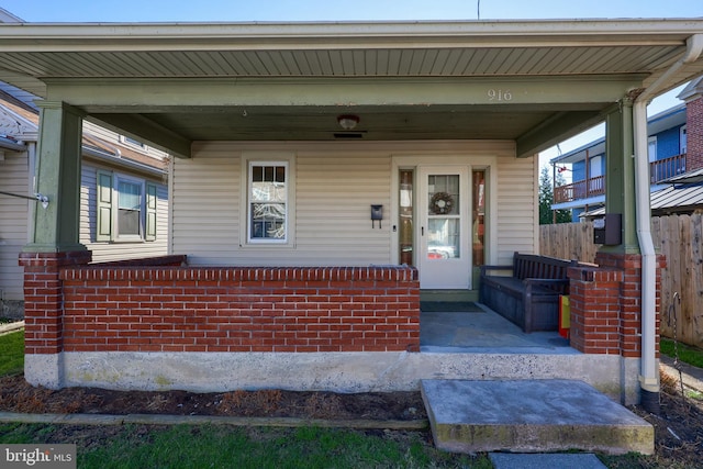 doorway to property featuring a porch