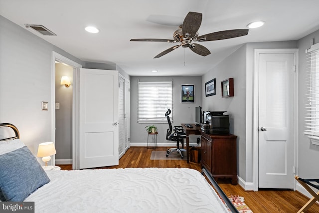 bedroom featuring ceiling fan and wood-type flooring