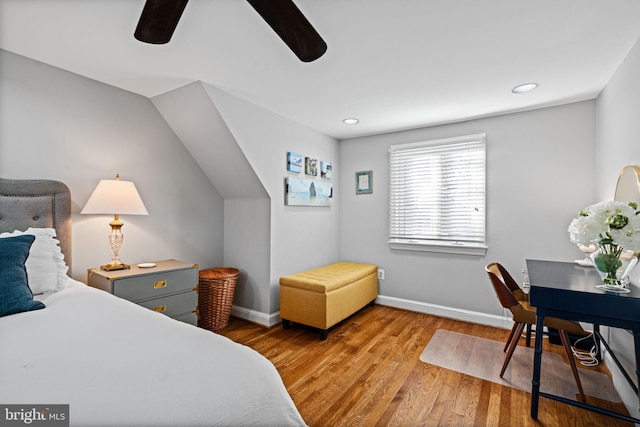 bedroom with ceiling fan and light hardwood / wood-style floors