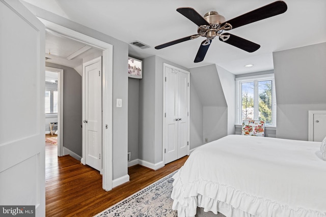 bedroom with ceiling fan and dark hardwood / wood-style flooring