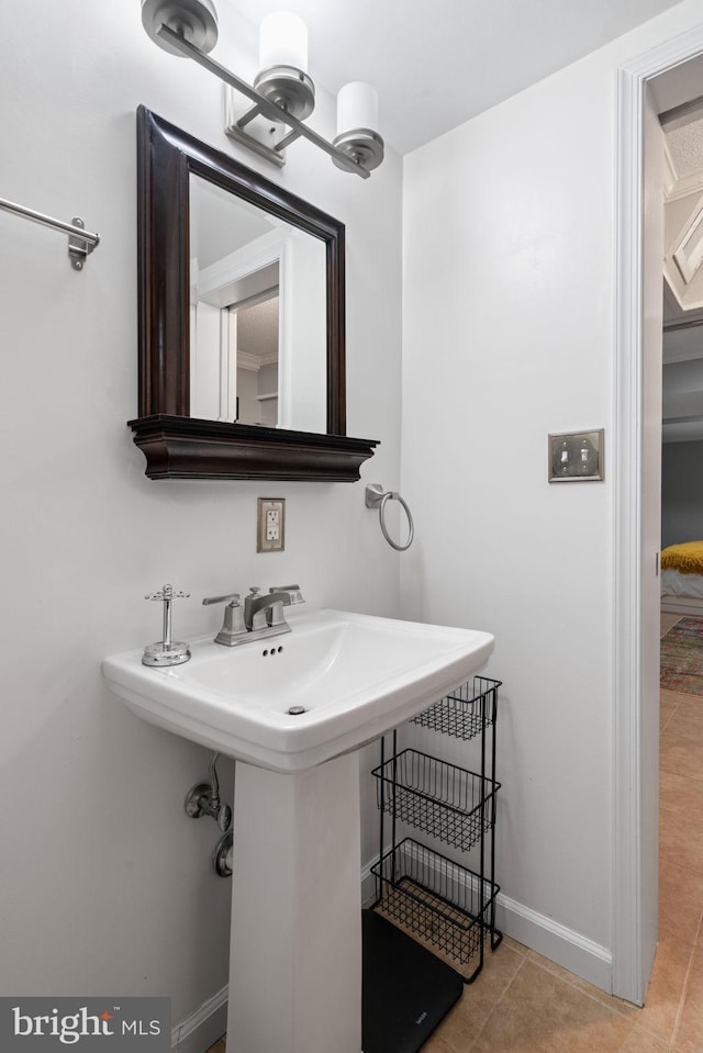 bathroom with tile patterned floors and sink