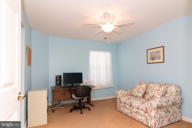 home office with ceiling fan and carpet flooring