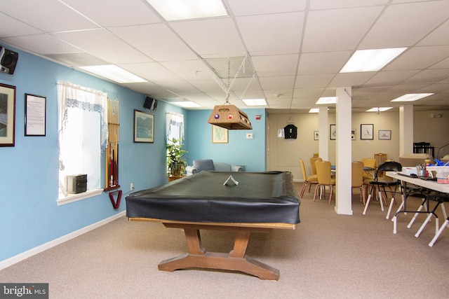 playroom featuring a drop ceiling, baseboards, and carpet flooring