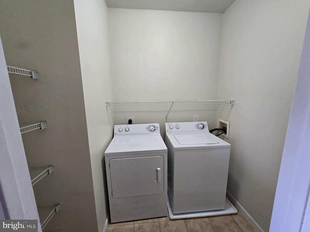 clothes washing area featuring washer and dryer