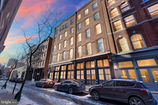 view of outdoor building at dusk