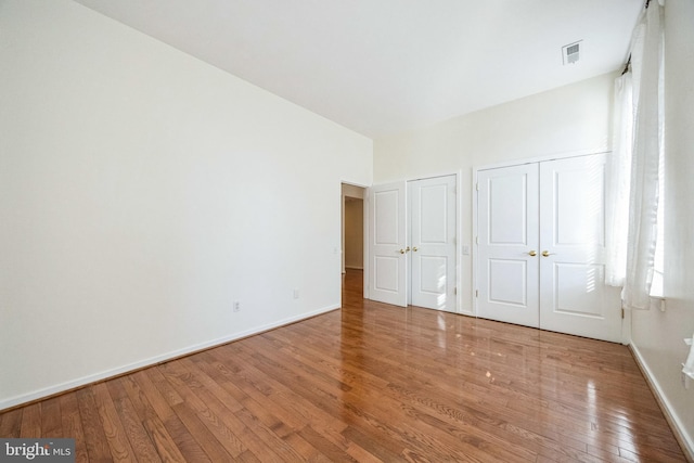 unfurnished bedroom featuring wood-type flooring