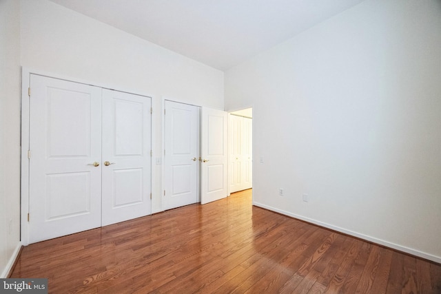 unfurnished bedroom with hardwood / wood-style flooring