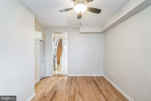 spare room featuring ceiling fan and light wood-type flooring