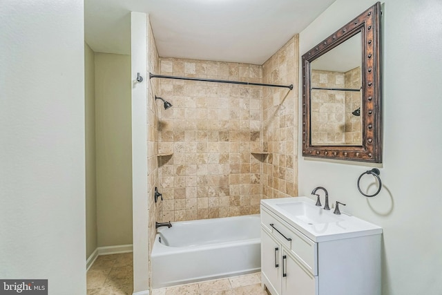 bathroom featuring vanity and tiled shower / bath combo