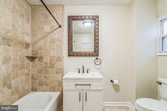 full bathroom featuring vanity, toilet, and tiled shower / bath