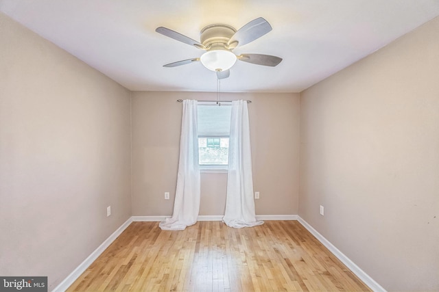 empty room with ceiling fan and light wood-type flooring