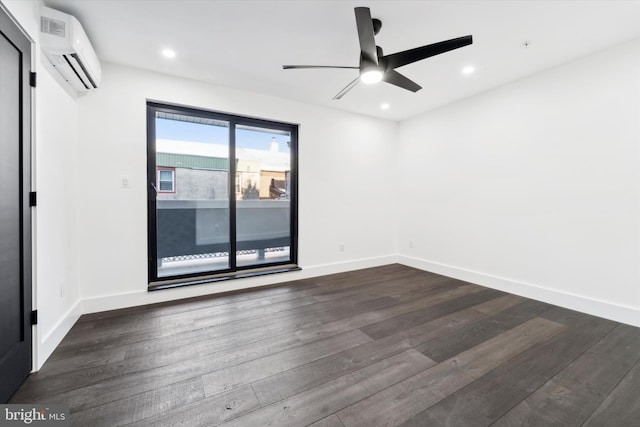 spare room with ceiling fan, dark hardwood / wood-style flooring, and an AC wall unit