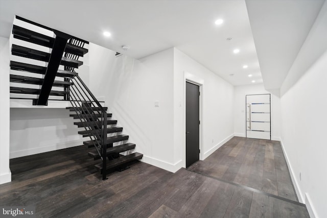 basement featuring dark wood-type flooring