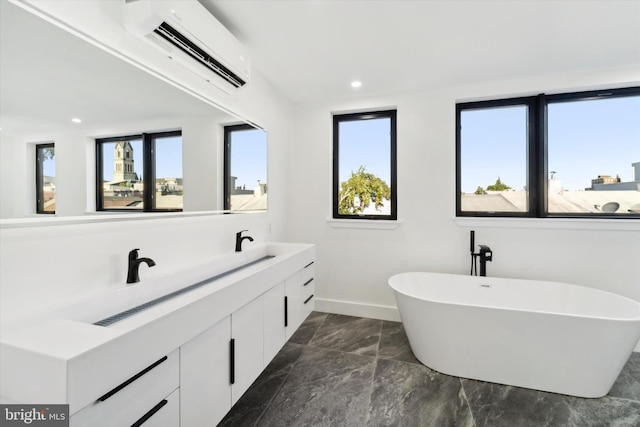 bathroom with a wall unit AC, a tub to relax in, and vanity