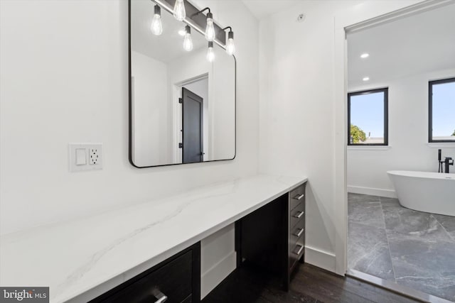 bathroom featuring a bathtub and vanity