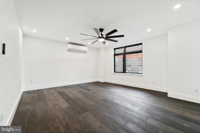 unfurnished room with dark hardwood / wood-style floors, an AC wall unit, and ceiling fan