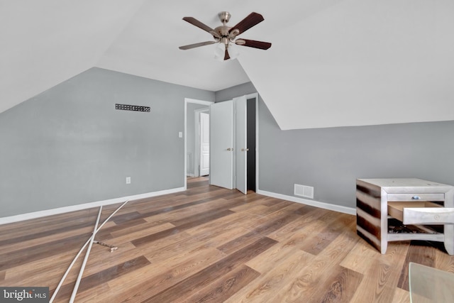 bonus room featuring hardwood / wood-style flooring, ceiling fan, and lofted ceiling