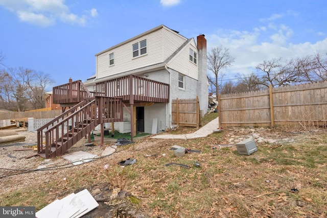 back of property featuring a deck