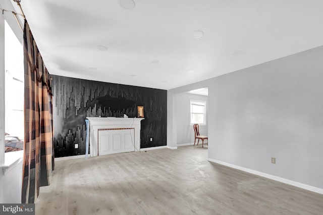 unfurnished living room with hardwood / wood-style flooring