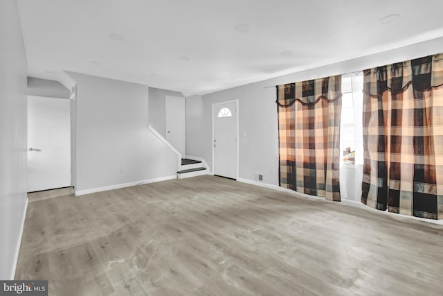 unfurnished room featuring light wood-type flooring