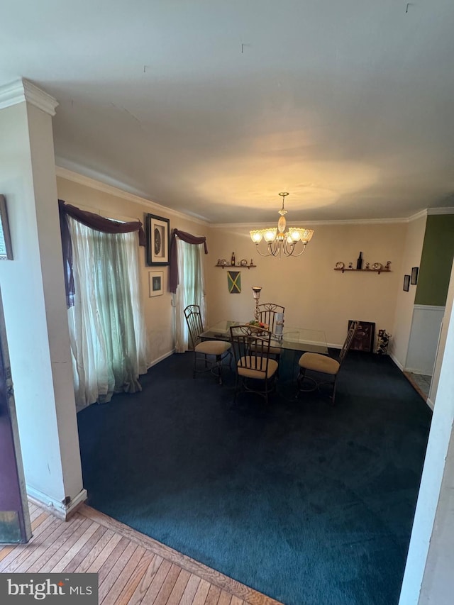 unfurnished dining area with an inviting chandelier and crown molding