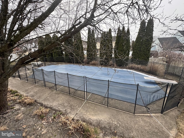 view of pool featuring a diving board