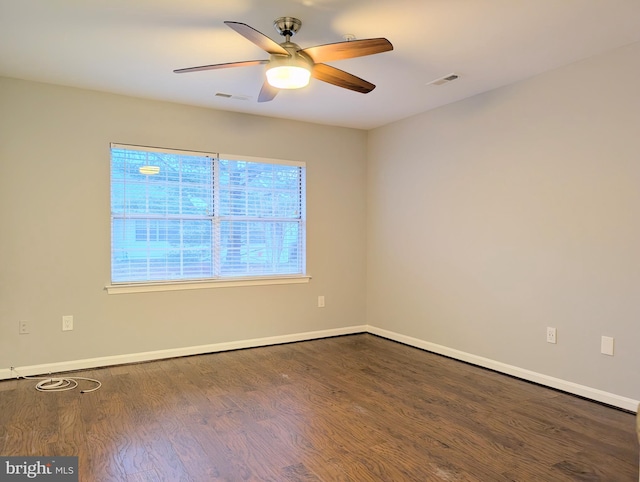 empty room with hardwood / wood-style flooring and ceiling fan