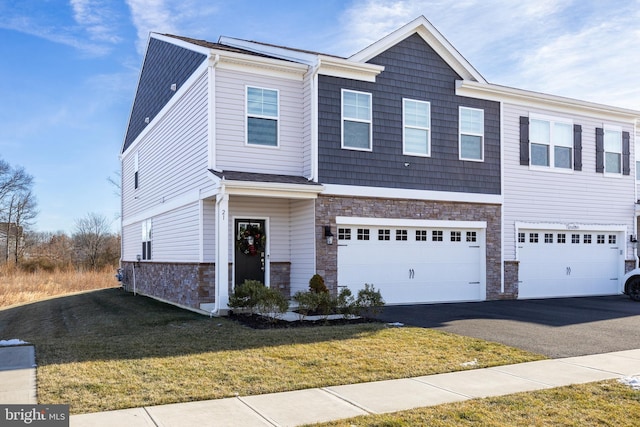 view of front of home with a garage and a front yard