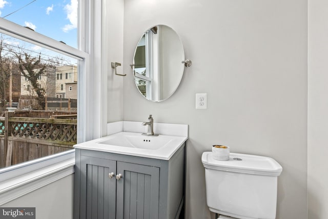 bathroom featuring vanity and toilet