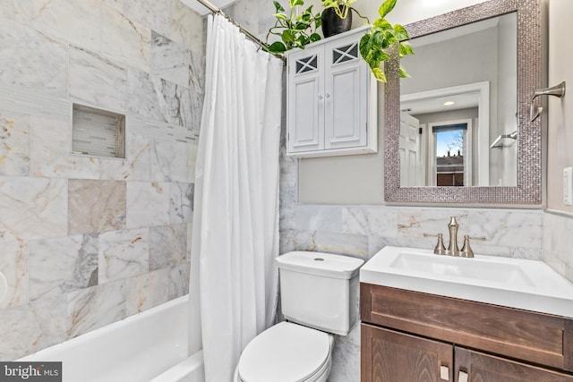 full bathroom featuring vanity, tile walls, toilet, and shower / bath combo with shower curtain