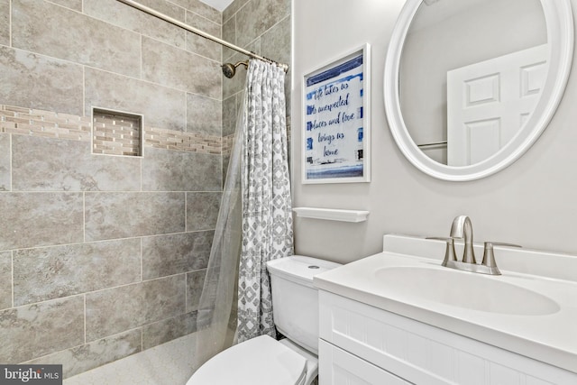 bathroom with vanity, a shower with curtain, and toilet