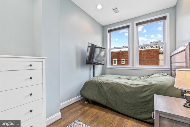 bedroom featuring dark hardwood / wood-style floors