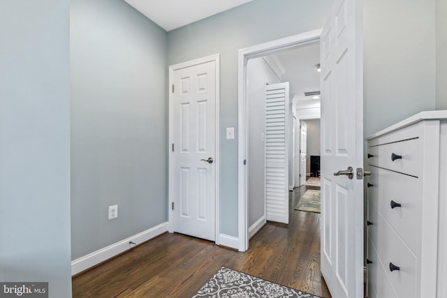 corridor with dark hardwood / wood-style floors