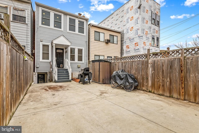 rear view of house featuring a patio